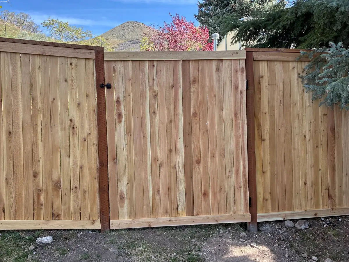 New cedar fence and gate with mountains behind